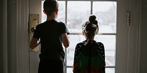 Children looking out a window